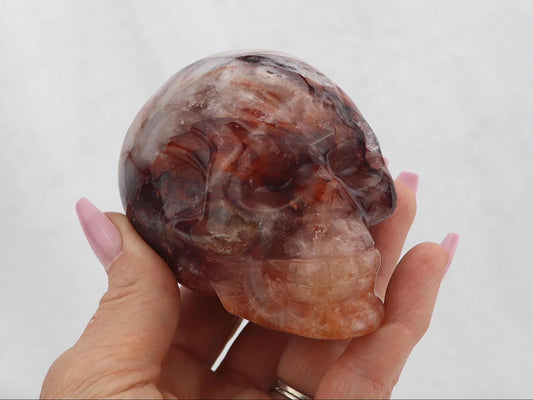 Polished Fire Quartz Crystal Skull Carving